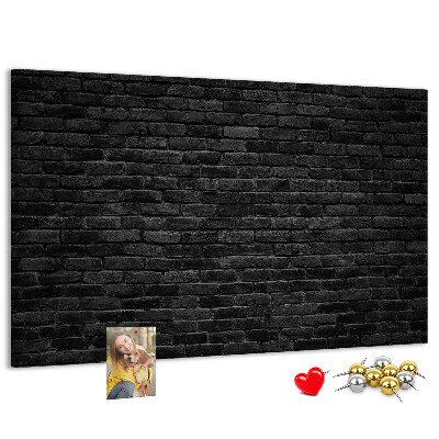 Lavagna di sughero con texture di muro in mattoni scuri dalla superficie ruvida