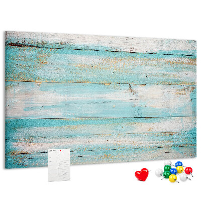 Lavagna di sughero con tavola di legno nelle tonalità del blu