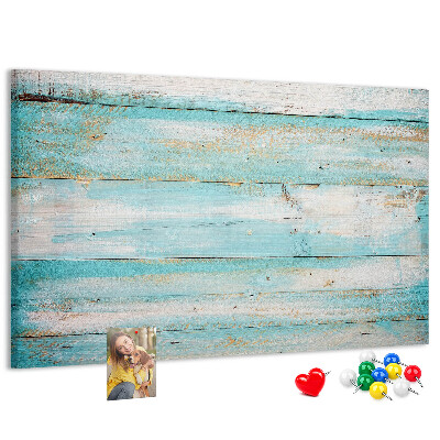 Lavagna di sughero con tavola di legno nelle tonalità del blu