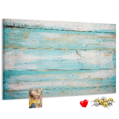 Lavagna di sughero con tavola di legno nelle tonalità del blu