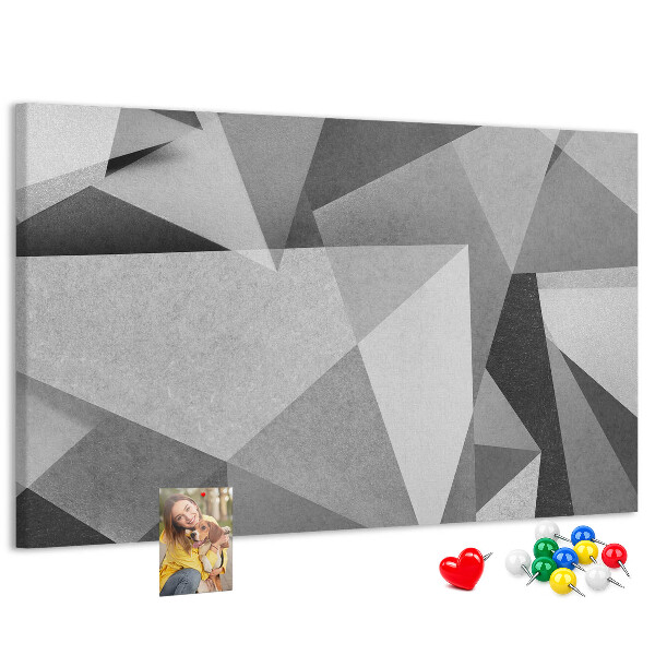 Lavagna di sughero con stampa di forme geometriche astratte grigie e nere