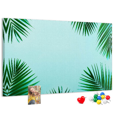 Bacheca in sughero con stampa di foglie tropicali su sfondo blu