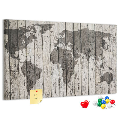 Bacheca in sughero con stampa di una mappa del mondo su sfondo di assi di legno