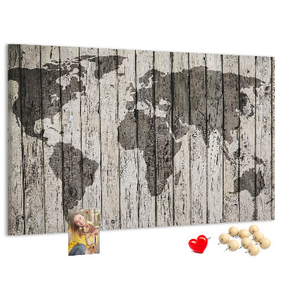 Bacheca in sughero con stampa di una mappa del mondo su sfondo di assi di legno