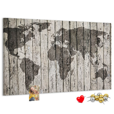 Bacheca in sughero con stampa di una mappa del mondo su sfondo di assi di legno