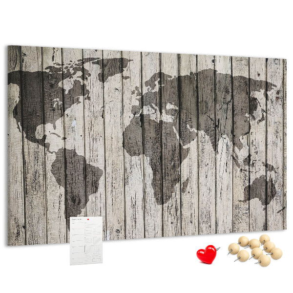 Bacheca in sughero con stampa di una mappa del mondo su sfondo di assi di legno