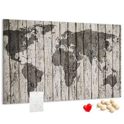 Bacheca in sughero con stampa di una mappa del mondo su sfondo di assi di legno