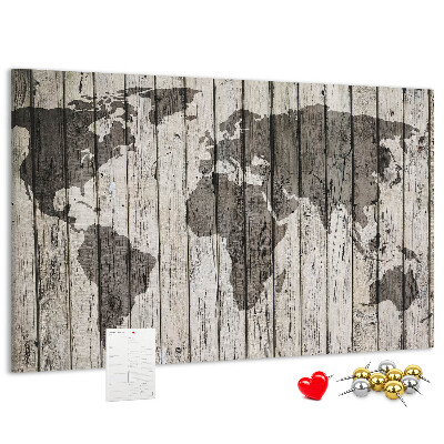 Bacheca in sughero con stampa di una mappa del mondo su sfondo di assi di legno