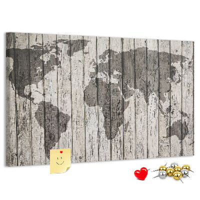 Bacheca in sughero con stampa di una mappa del mondo su sfondo di assi di legno