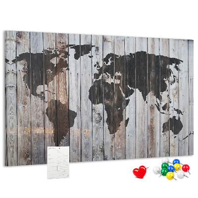 Bacheca in sughero con stampa di una mappa del mondo su sfondo di assi di legno