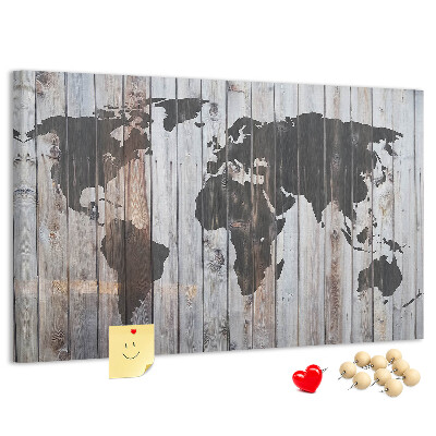 Bacheca in sughero con stampa di una mappa del mondo su sfondo di assi di legno