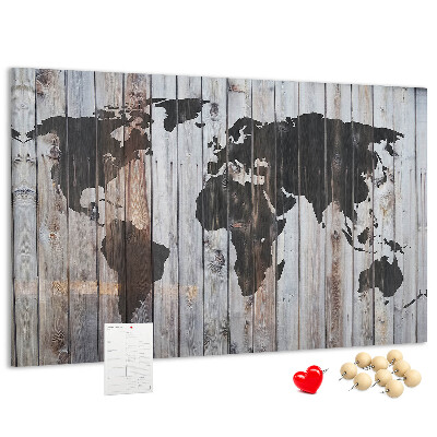 Bacheca in sughero con stampa di una mappa del mondo su sfondo di assi di legno