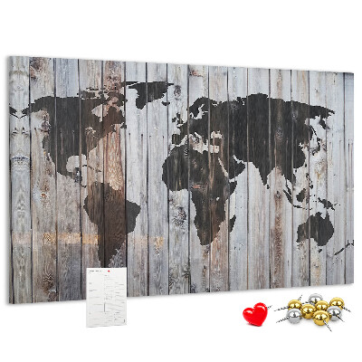 Bacheca in sughero con stampa di una mappa del mondo su sfondo di assi di legno