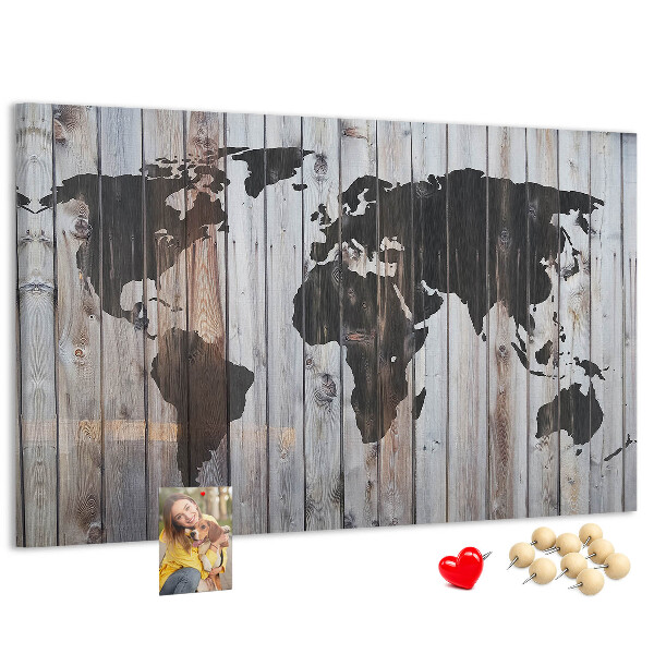 Bacheca in sughero con stampa di una mappa del mondo su sfondo di assi di legno