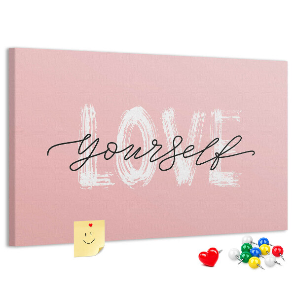 Lavagna di sughero con grafica Amore per se stessi su sfondo rosa