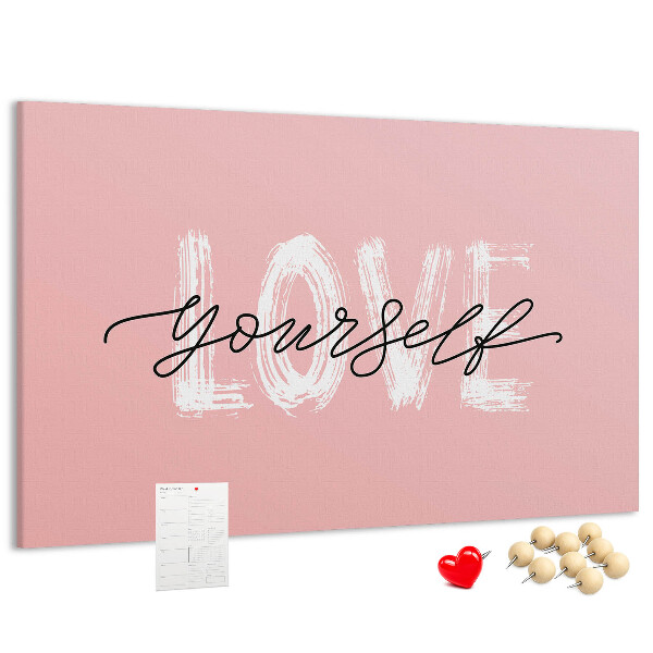 Lavagna di sughero con grafica Amore per se stessi su sfondo rosa