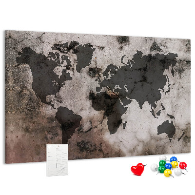 Bacheca in sughero con stampa di una mappa del mondo effetto ruggine su sfondo in cemento