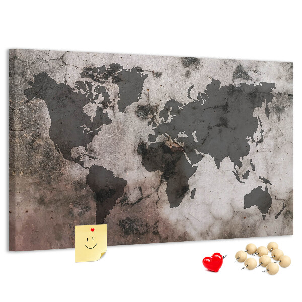 Bacheca in sughero con stampa di una mappa del mondo effetto ruggine su sfondo in cemento