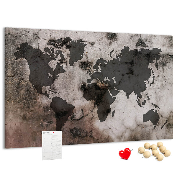Bacheca in sughero con stampa di una mappa del mondo effetto ruggine su sfondo in cemento