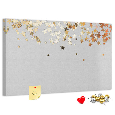 Bacheca in sughero con stampa di stelle dorate su sfondo grigio