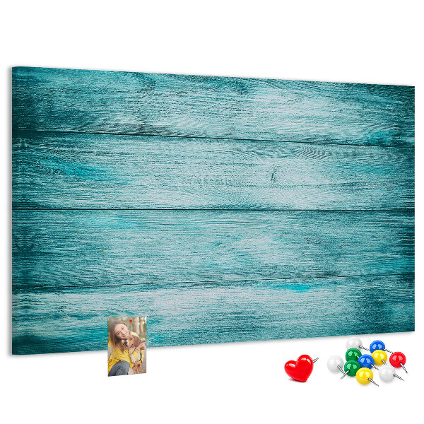 Bacheca in sughero con sfondo in assi di legno verdi e blu