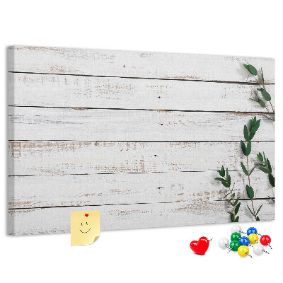 Bacheca in sughero con cornice in legno rustico e rami verdi
