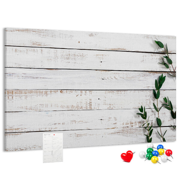 Bacheca in sughero con cornice in legno rustico e rami verdi