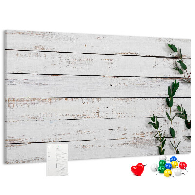 Bacheca in sughero con cornice in legno rustico e rami verdi
