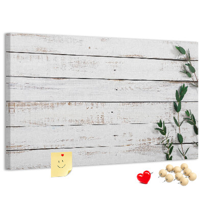 Bacheca in sughero con cornice in legno rustico e rami verdi