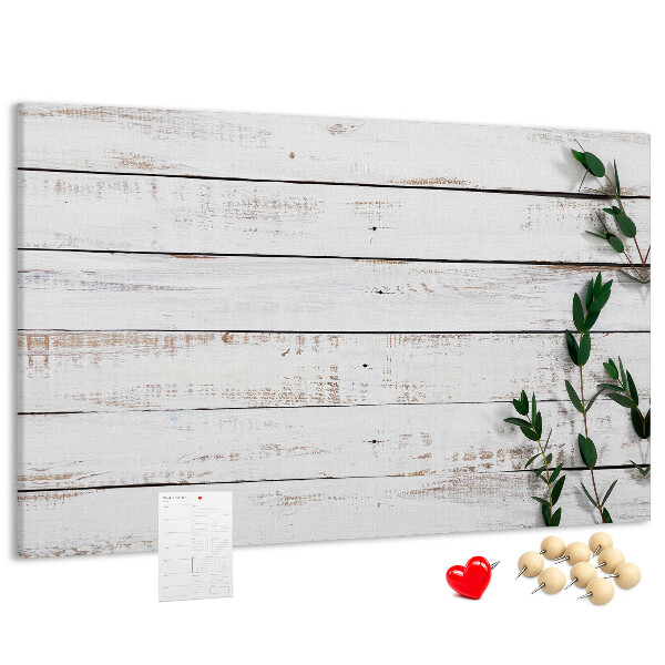 Bacheca in sughero con cornice in legno rustico e rami verdi