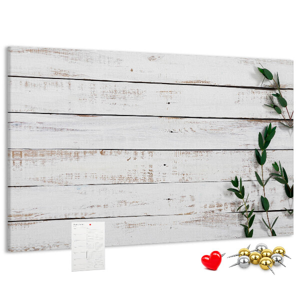 Bacheca in sughero con cornice in legno rustico e rami verdi