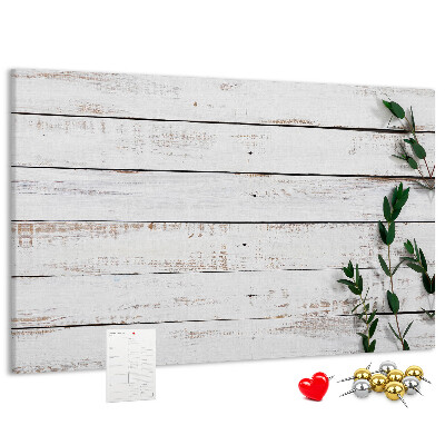 Bacheca in sughero con cornice in legno rustico e rami verdi