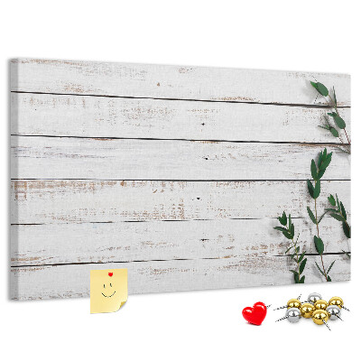 Bacheca in sughero con cornice in legno rustico e rami verdi