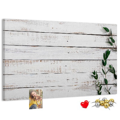 Bacheca in sughero con cornice in legno rustico e rami verdi
