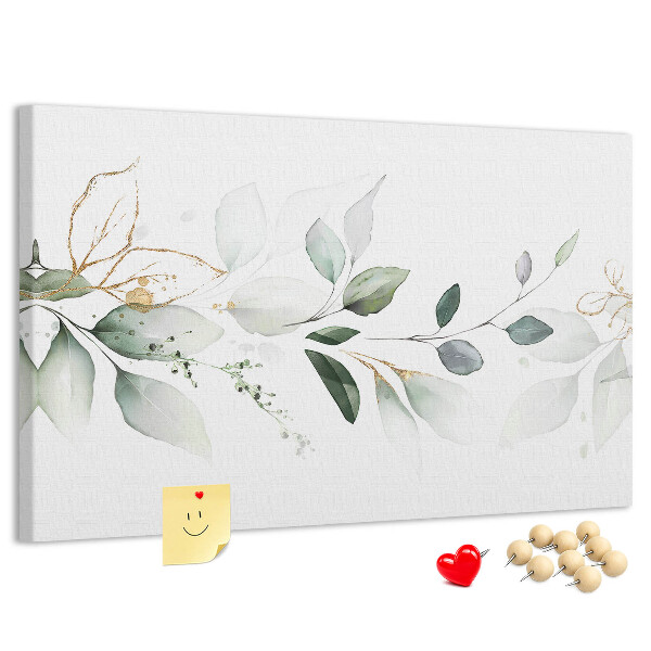 Bacheca in sughero con foglie delicate e dettagli dorati