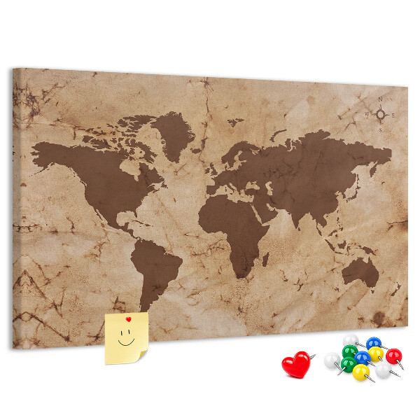 Lavagna di sughero con mappa del mondo antico su sfondo marrone