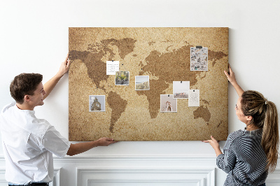Lavagna di sughero con stampa antica mappa del mondo su sfondo bronzo