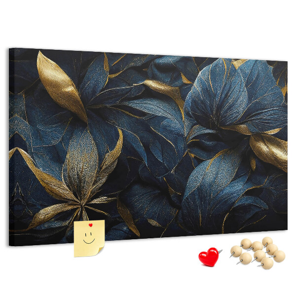 Lavagna di sughero con stampa di foglie dorate su sfondo blu scuro