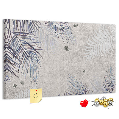 Bacheca in sughero con motivo di foglie delicate su sfondo grigio