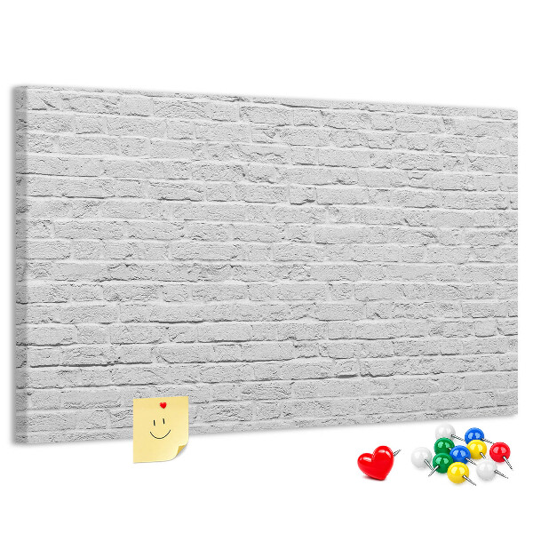 Bacheca in sughero con stampa effetto muro di mattoni bianchi e puntine colorate