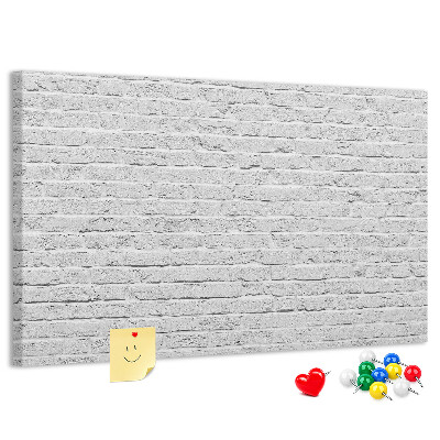 Bacheca in sughero con stampa effetto muro di mattoni bianchi e puntine colorate