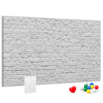 Bacheca in sughero con stampa effetto muro di mattoni bianchi e puntine colorate