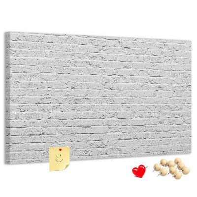 Bacheca in sughero con stampa effetto muro di mattoni bianchi e puntine colorate