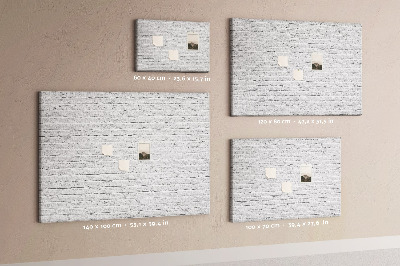 Bacheca in sughero con stampa effetto muro di mattoni bianchi e puntine colorate