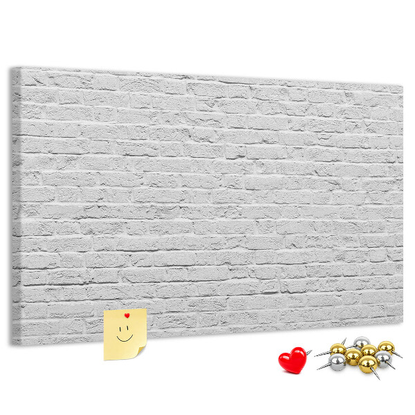 Bacheca in sughero con stampa effetto muro di mattoni bianchi e puntine colorate