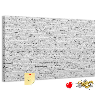 Bacheca in sughero con stampa effetto muro di mattoni bianchi e puntine colorate