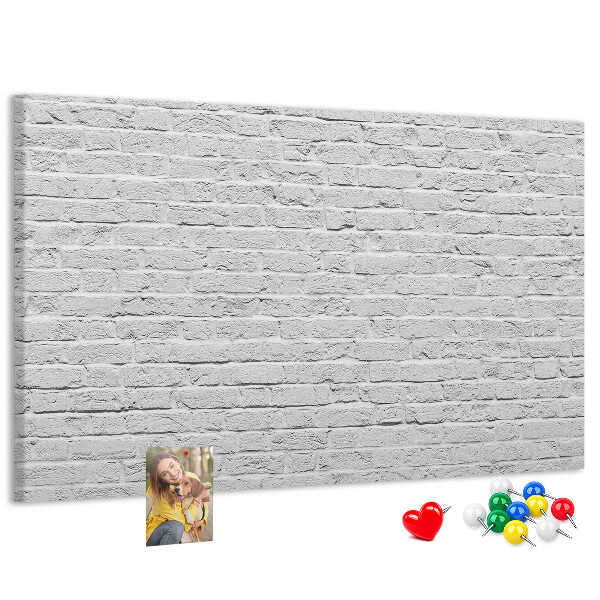 Bacheca in sughero con stampa effetto muro di mattoni bianchi e puntine colorate