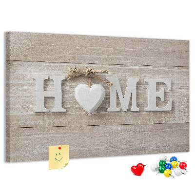 Lavagna di sughero con scritta elegante HOME e decorazione a cuore