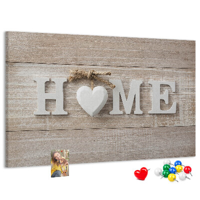 Lavagna di sughero con scritta elegante HOME e decorazione a cuore