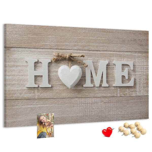 Lavagna di sughero con scritta elegante HOME e decorazione a cuore